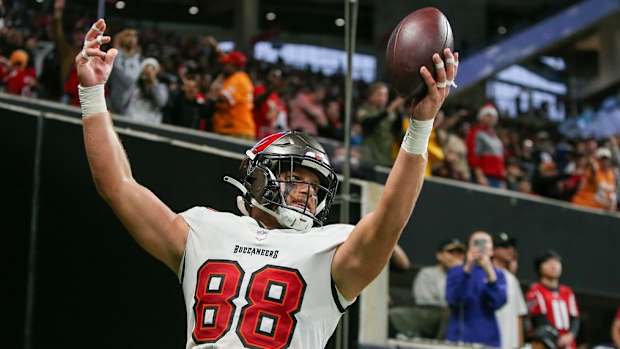 Cade Otton celebrates his last-second, game-winning touchdown catch against Atlanta.
